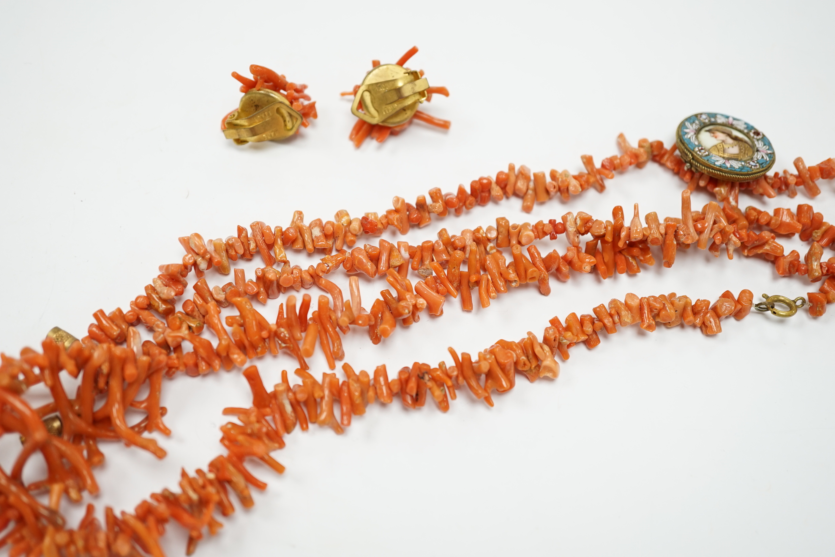 Two jagged coral necklaces, 46cm with a pair of similar earrings and a micro-mosaic and porcelain panel brooch (a.f.).